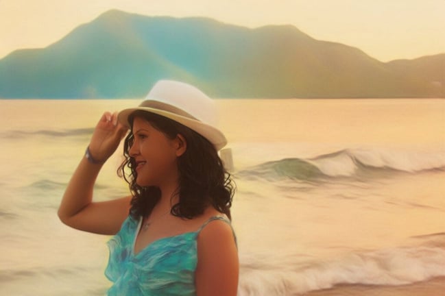 Picture of Karol waring a hat in the beach